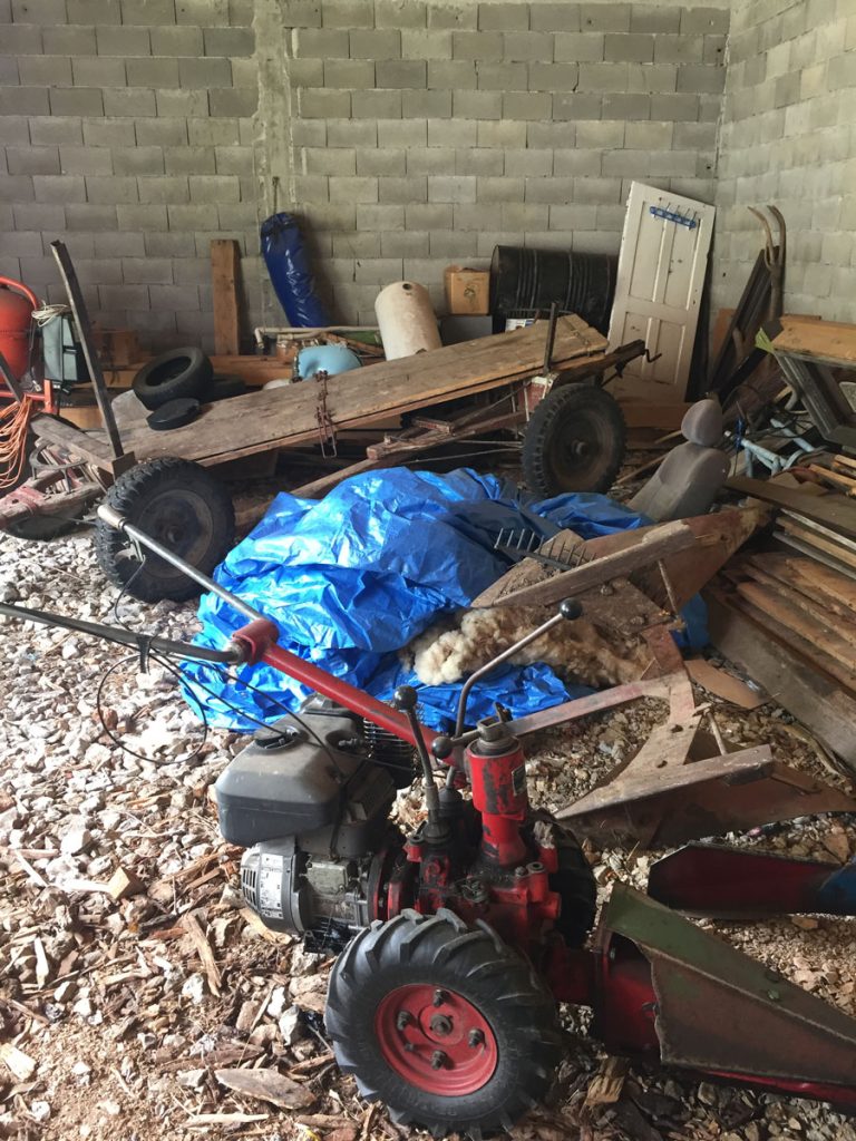 storage interior with agricultural machines and a carriage