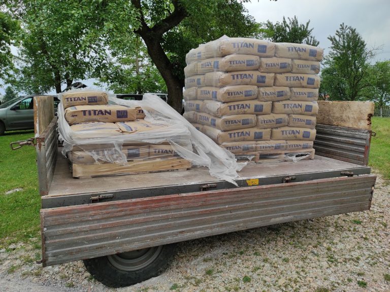 a trailer full of cement bags