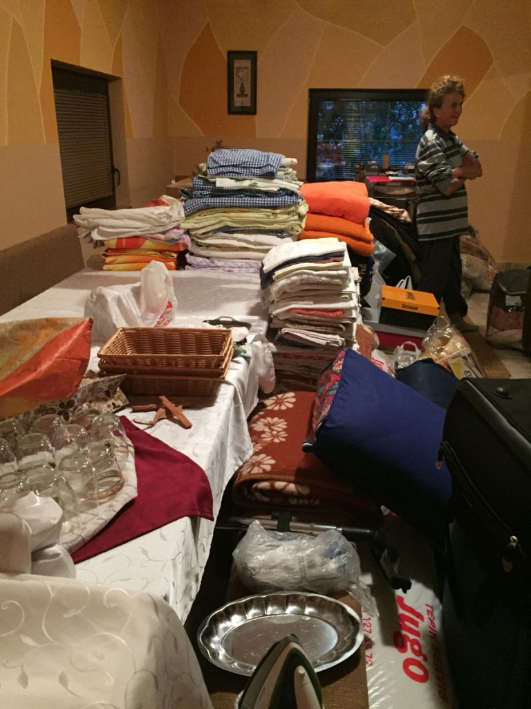 a woman in a slava room with her belongings