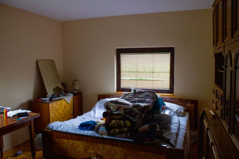 bedroom interior with a bad and a window