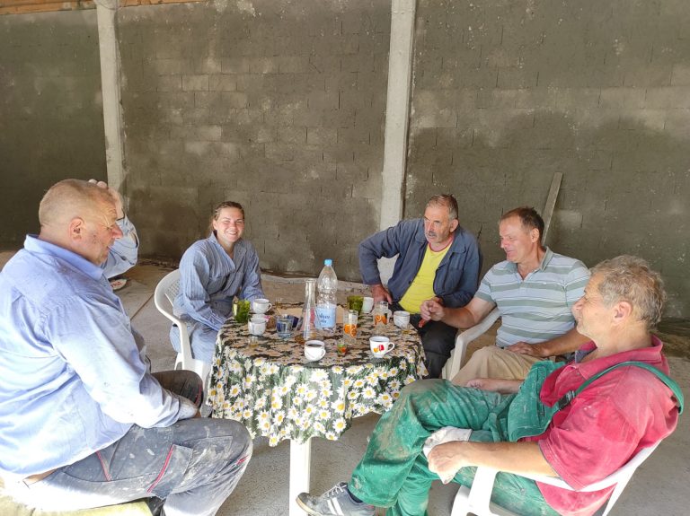 workers on a coffee break in a new garage