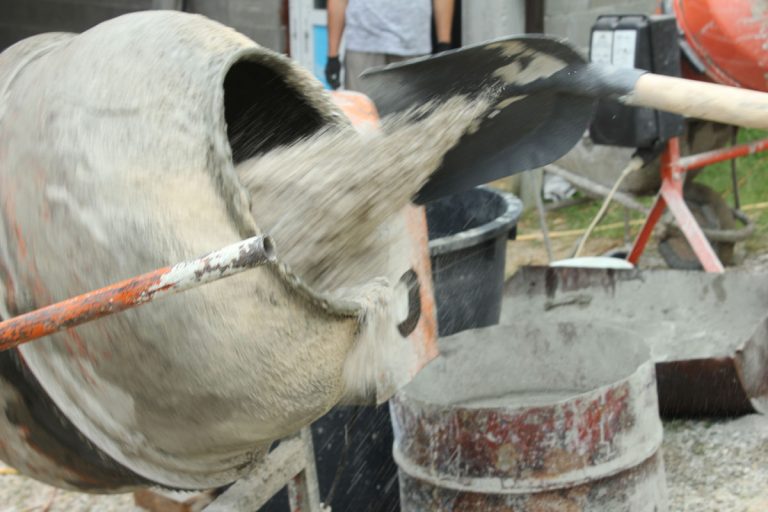 concrete mixer and a shovel gravel