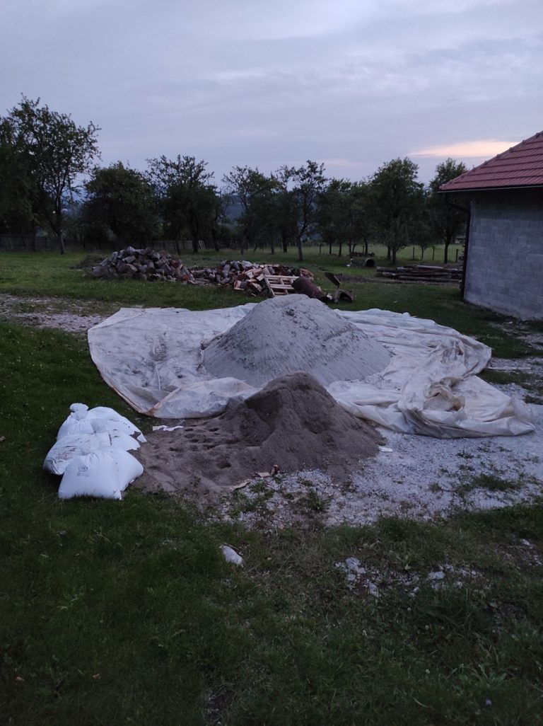 sand dunes in a field next to the garage