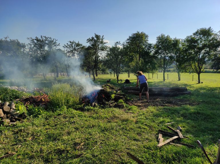 a woman clining a backyard