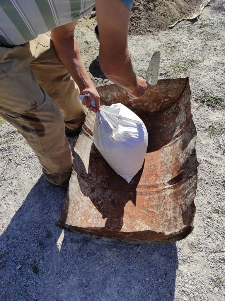a worker prepairin lime for mortaring