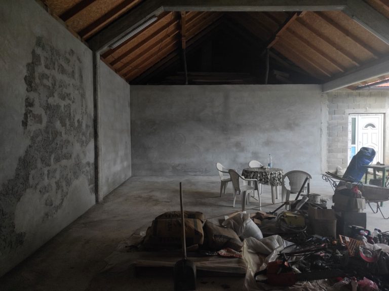 a garage interior with mortared walls