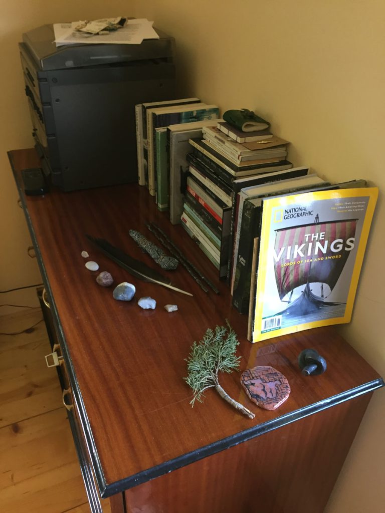 an old cabinet with books and memorabilia