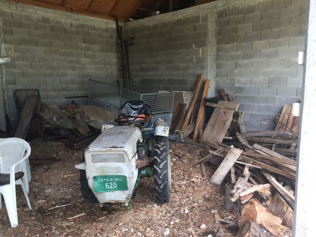 an old tractor in a garage