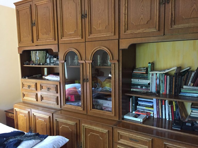 an old socialistic cabinet with bookshelf