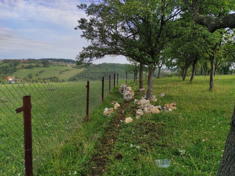 a stonewall by the fence