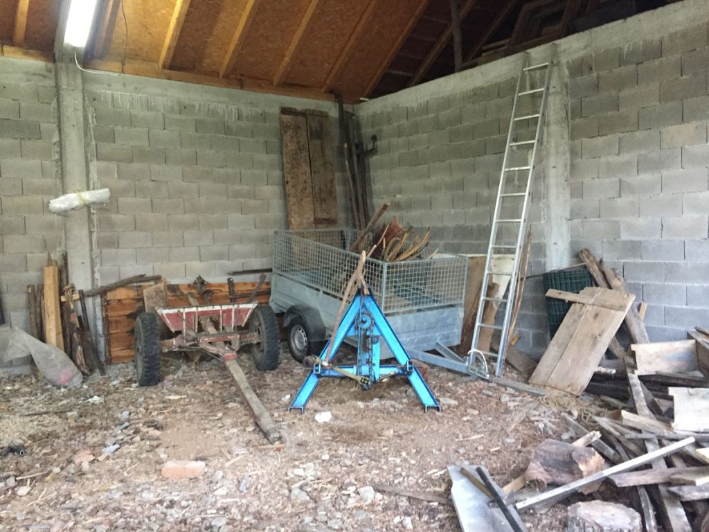 trailer and a carriage in a garage