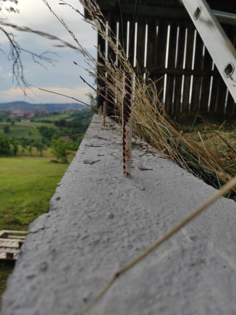 a concrete curb on a hayloft