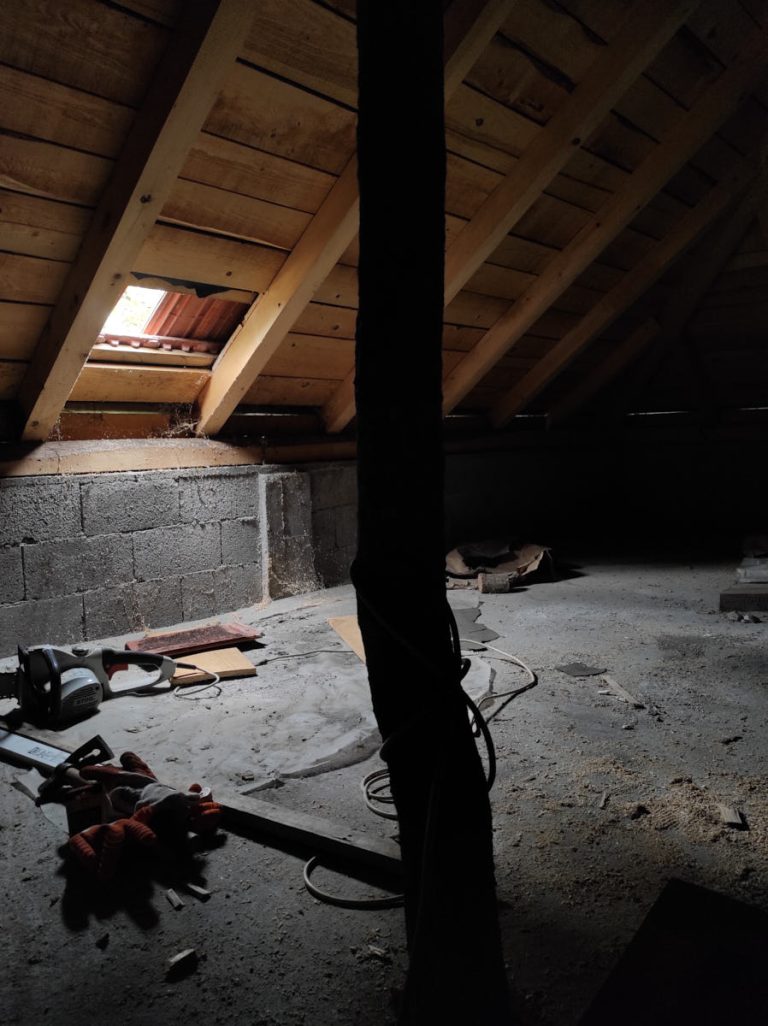 a worker reconstructing a roof