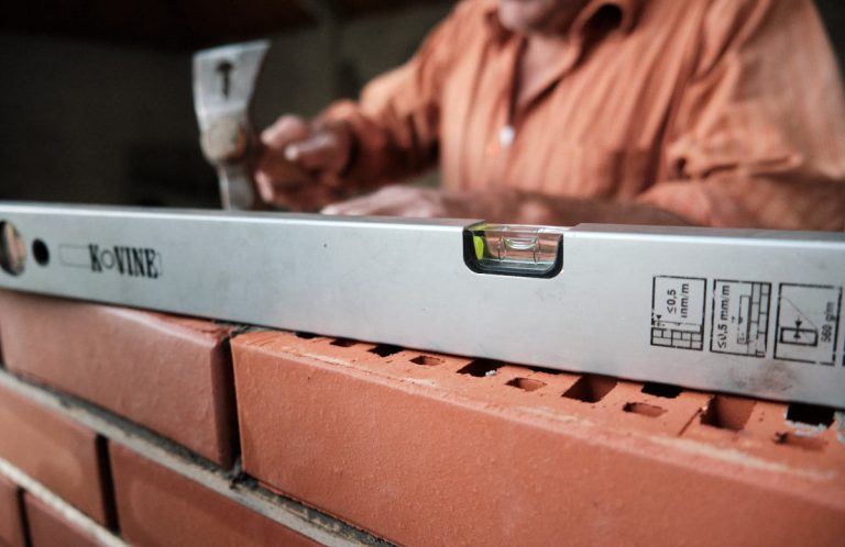 a level on a brick wall