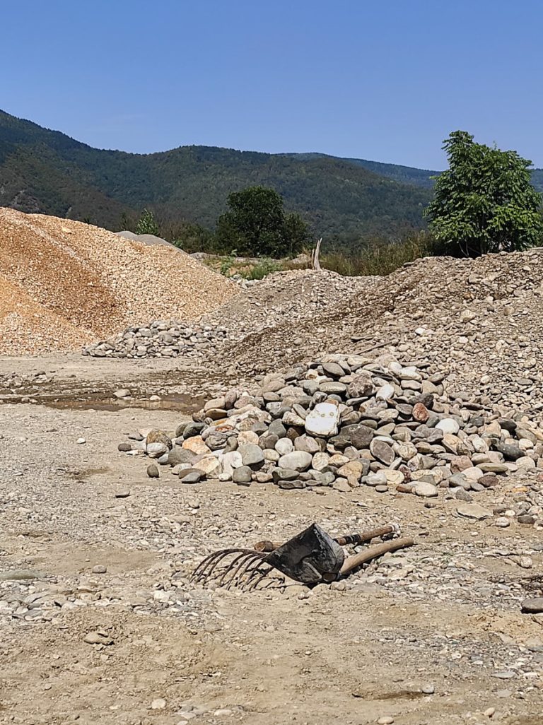 a cobblestone mine with a shovel and a hayfork