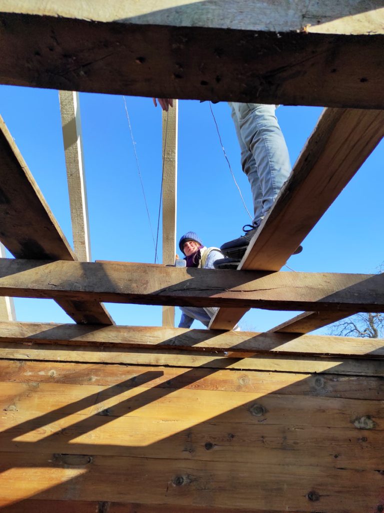 workers building a new roof construction