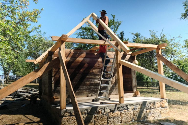 workers building a new roof construction