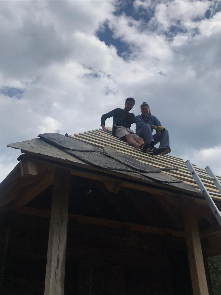 workers on a roof construction