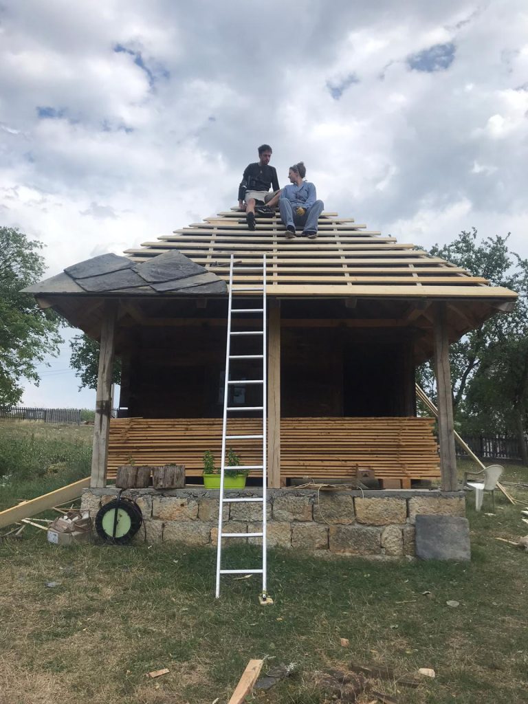 workers on a roof construction
