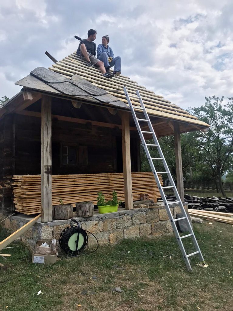 workers on a roof construction