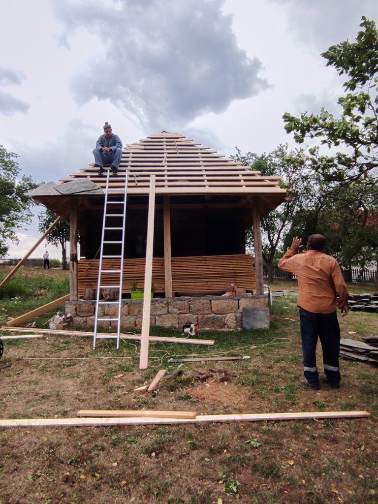 workers are building new roof tiles