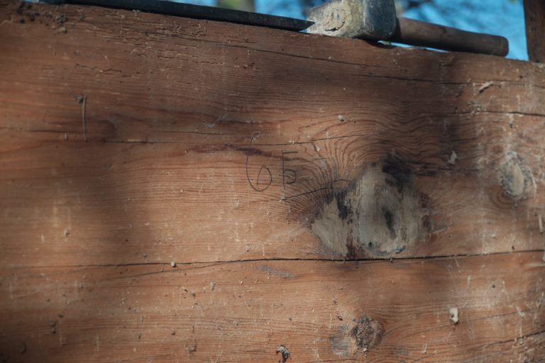 an old wooden cottage log markings