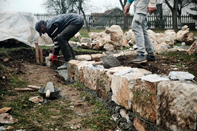 workers building a cottage foundation