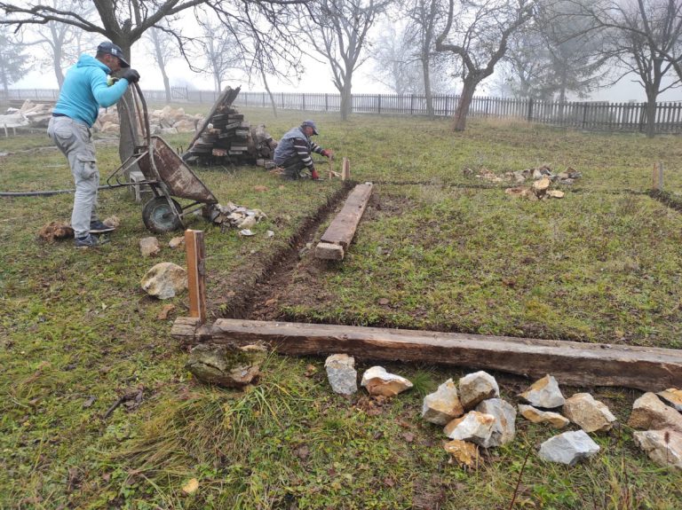 workers building a cottage foundation