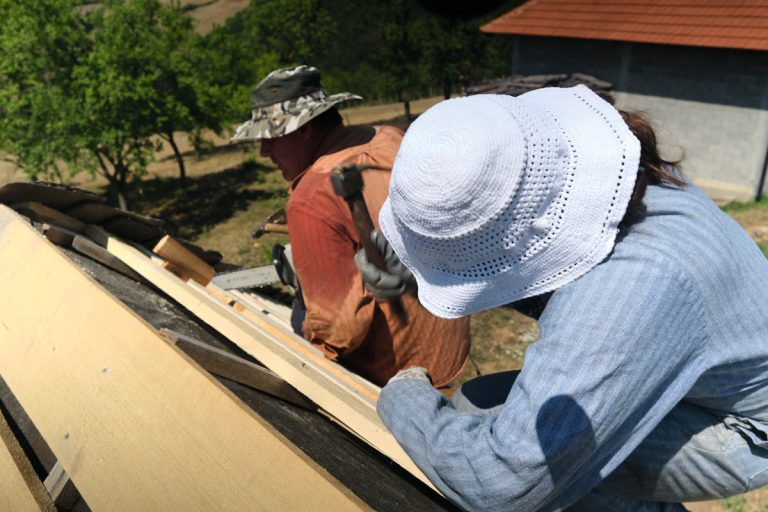 workers building a new roof construction