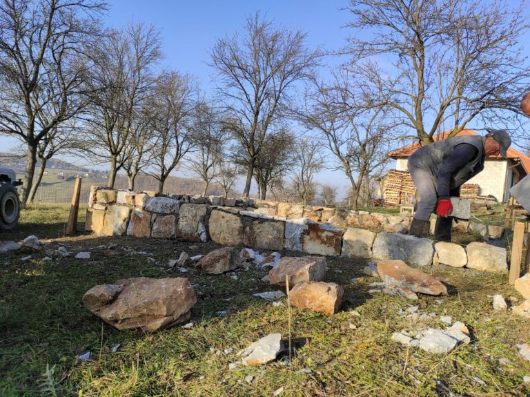 workers building a cottage foundation