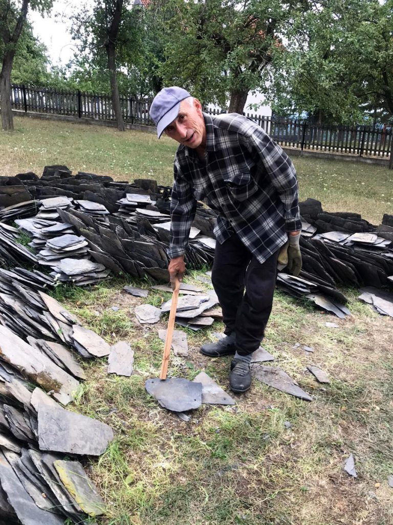 a worker posing next to the slats
