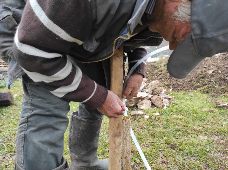 a worker building a cottage foundation