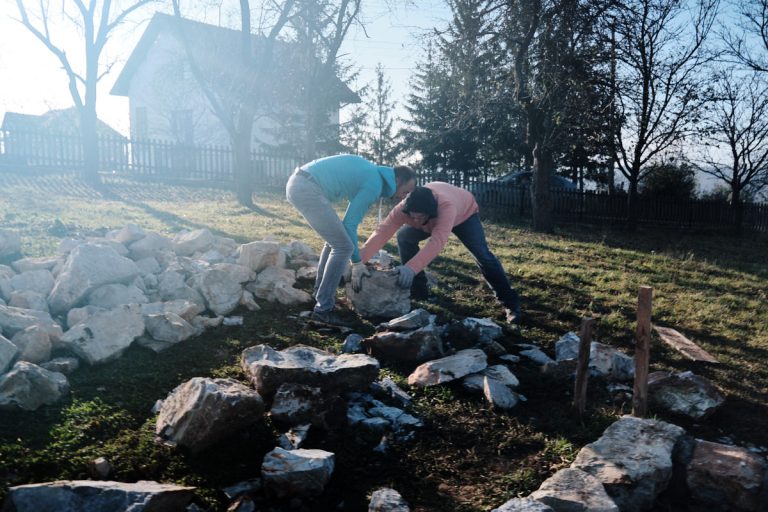 workers building a cottage foundation