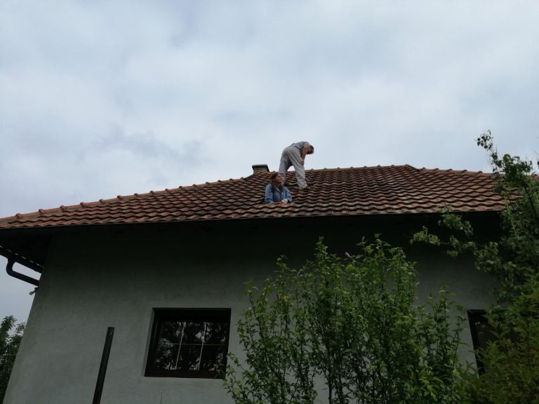 workers reconstructing a roof