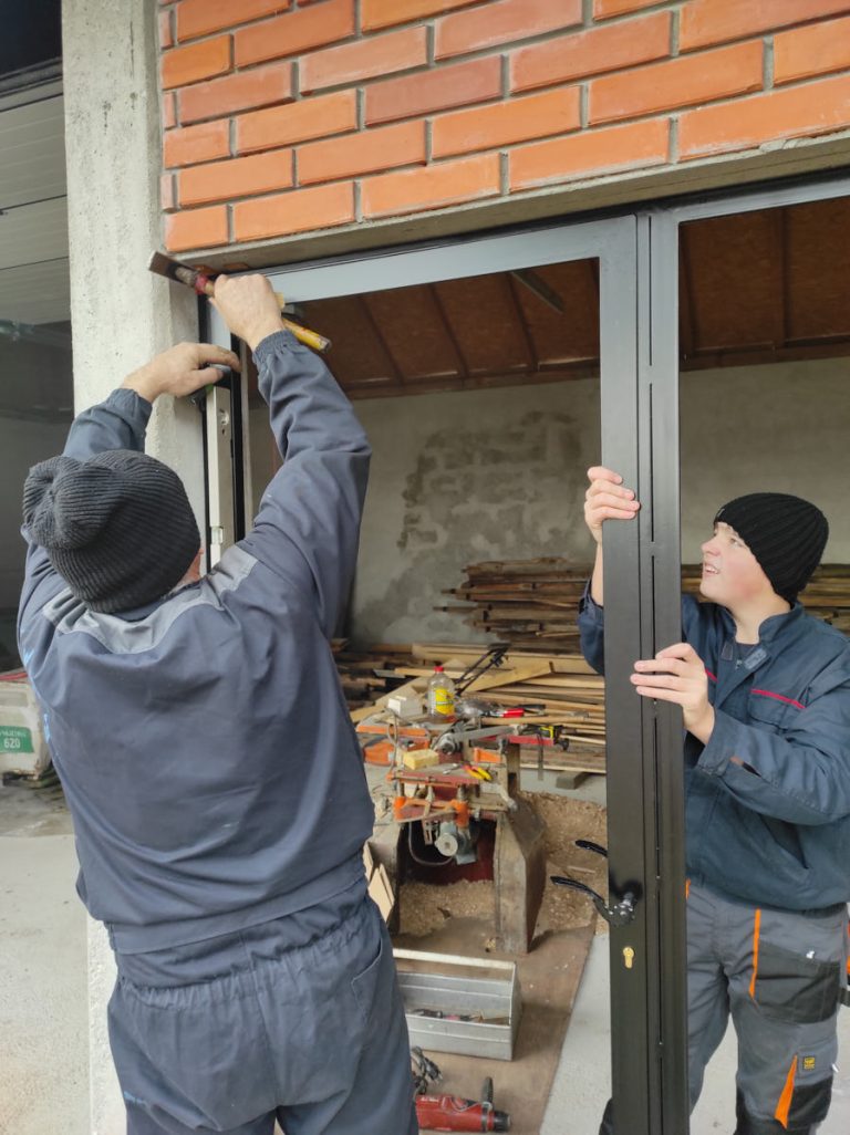 workers install the door frame