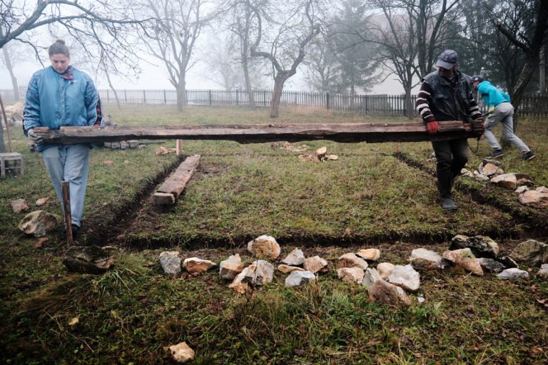 workers building a cottage foundation