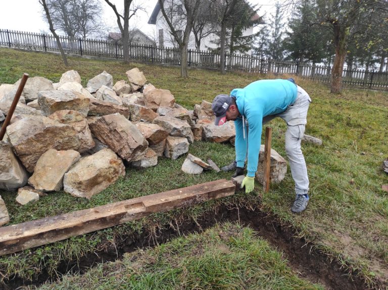 a worker building a cottage foundation slab