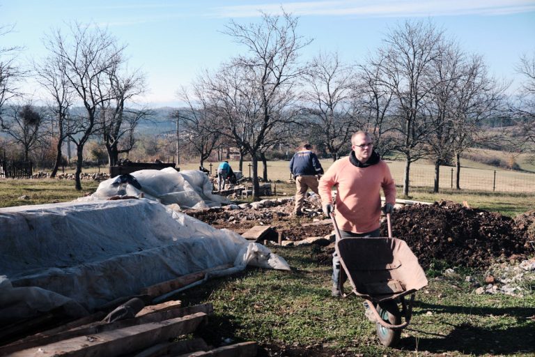 workers digging a cottage foundation