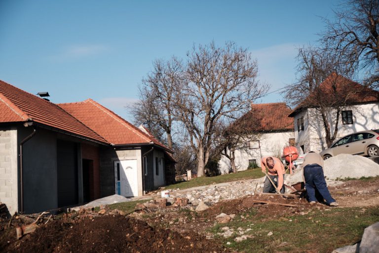 workers digging a cottage foundation