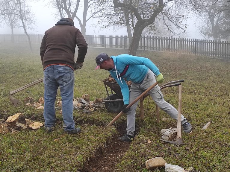 workers building a cottage foundation