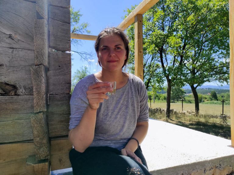 a woman on a break sipping a liquor