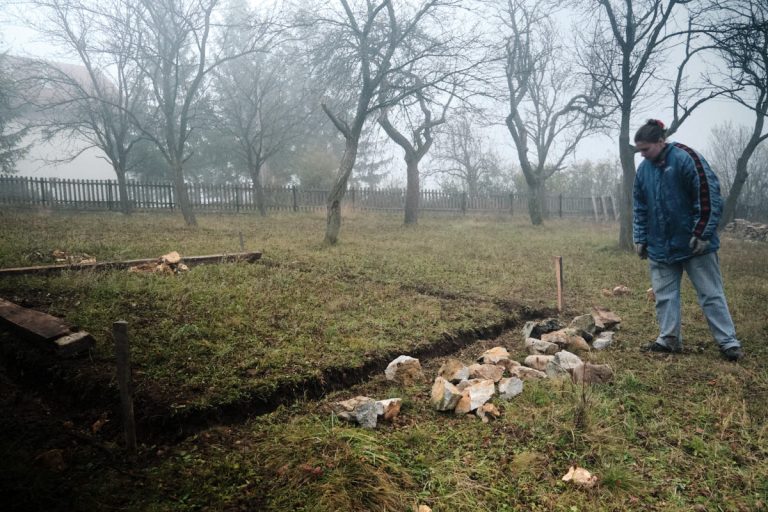 a woman building a cottage foundation