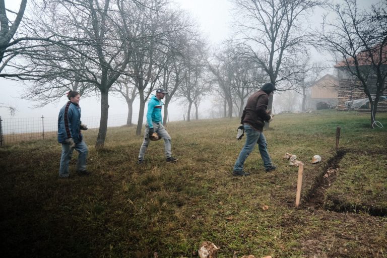 workers building a cottage foundation