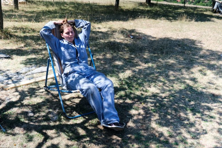a woman on a break taking a rest in the shade