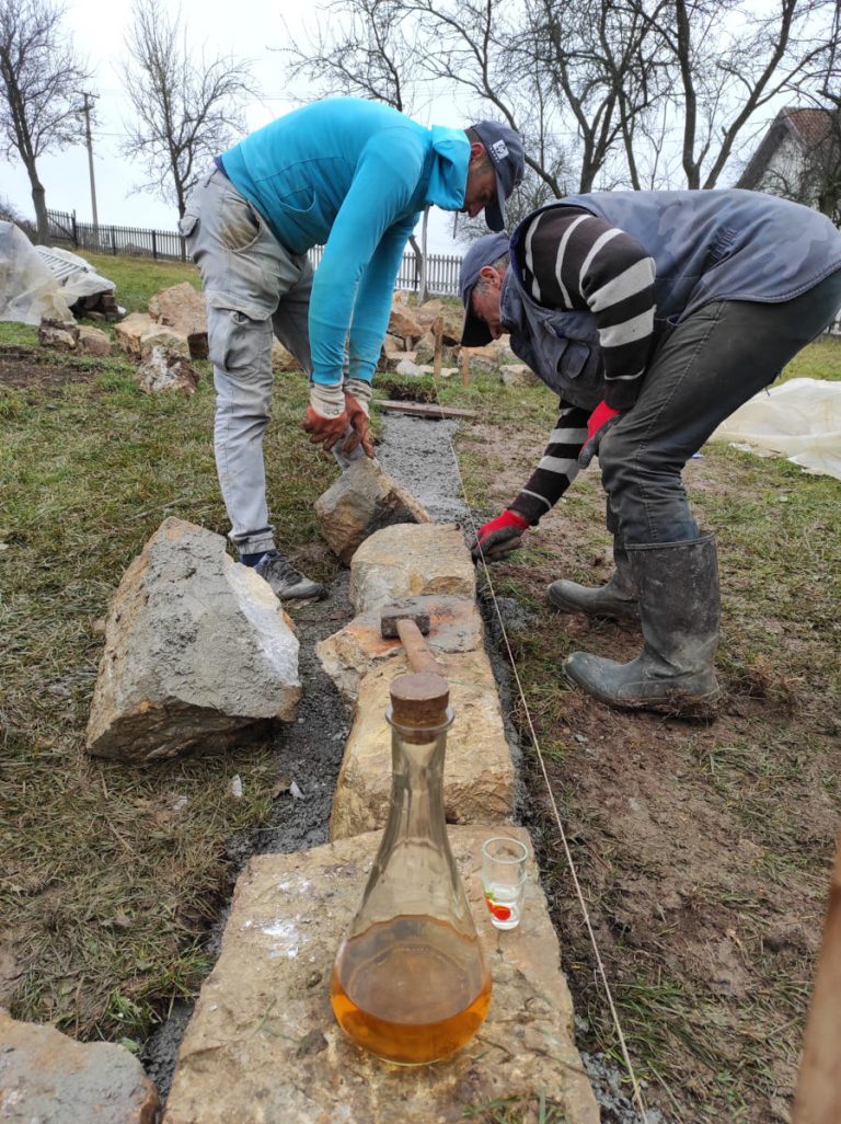 workers building a cottage foundation