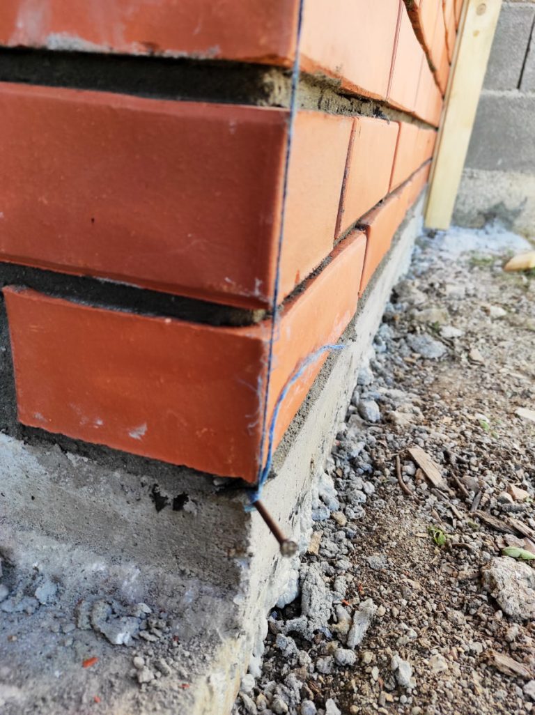 a mason thread and a brick wall