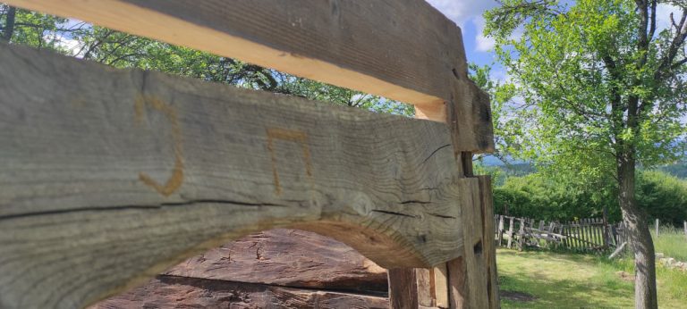 an old wooden cabin door portal arch