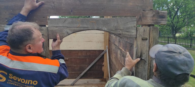 an old wooden cabin door portal arch building