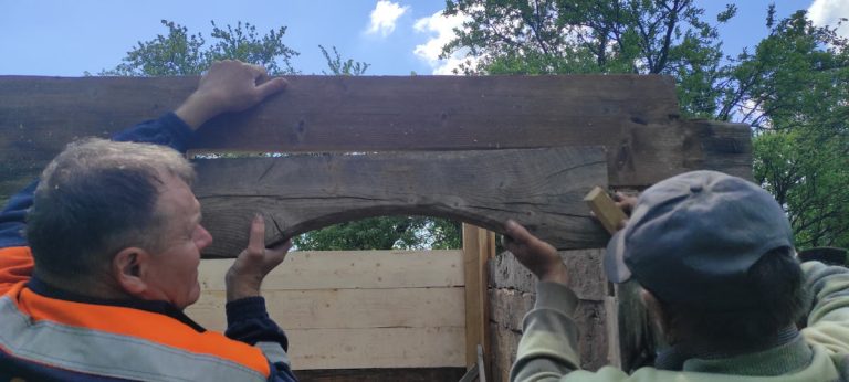 an old wooden cabin door portal arch building