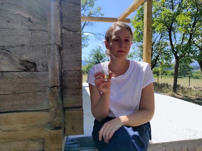 a woman on a break sipping a liquor